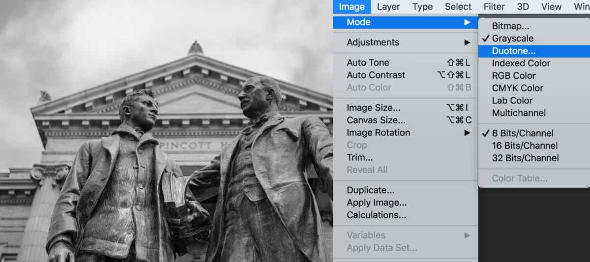 Example image is now shown in grayscale. Photoshop interface show the menu structure to find Image > Mode> Duotone
