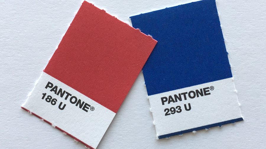 Cardstock cutouts of Pantone swatches for KU crimson and blue